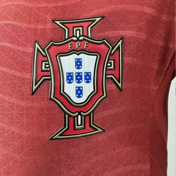 jerseyforge-portugal-soccer-crest-silicon-detail 2026 Portugal Style National Team Soccer Jersey - Elite Red Wave Edition - Unbranded High-Performance Teamwear