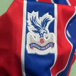 Sharp Crystal Palace FC eagle crest on striped jersey using Custom Soccer Jersey Embroidery.